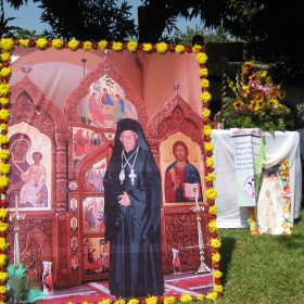 A life-size photo of Fr. Andres animates his memory on church property in Nueva Concepción