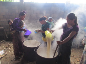 Mayan women cook for the men as they work