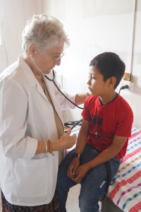 Dr. Sanda examines a child