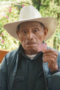 Patient displays his number for treatment