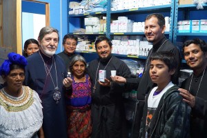 His Eminence, Metropolitan Athenagoras, stands in the pharmacy of the Aguacate Clinic