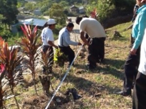 Church members taking measurements for the new church